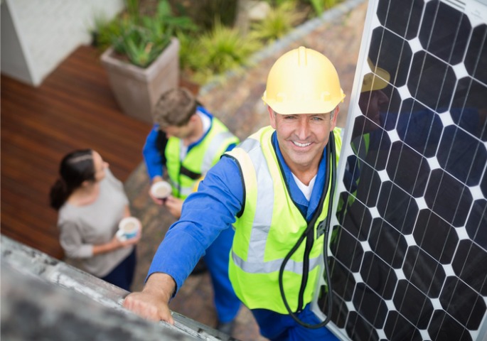 A contractor from Prime Vision Renovations performing Solar Panel Removal & Replacement for a Central Florida home