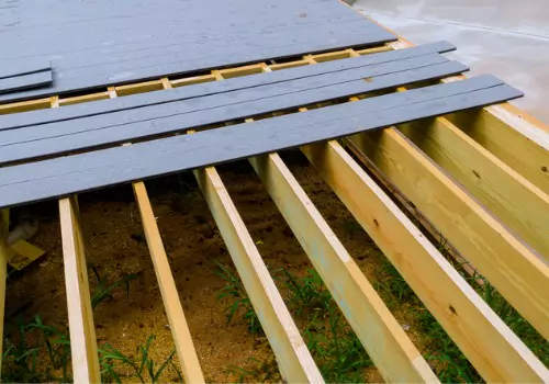 A Deck Contractor for Dade City FL installing composite decking onto a new frame