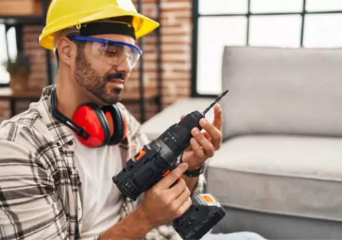 A Handyman in Spring Hill FL getting his drill ready to do some light maintenance work